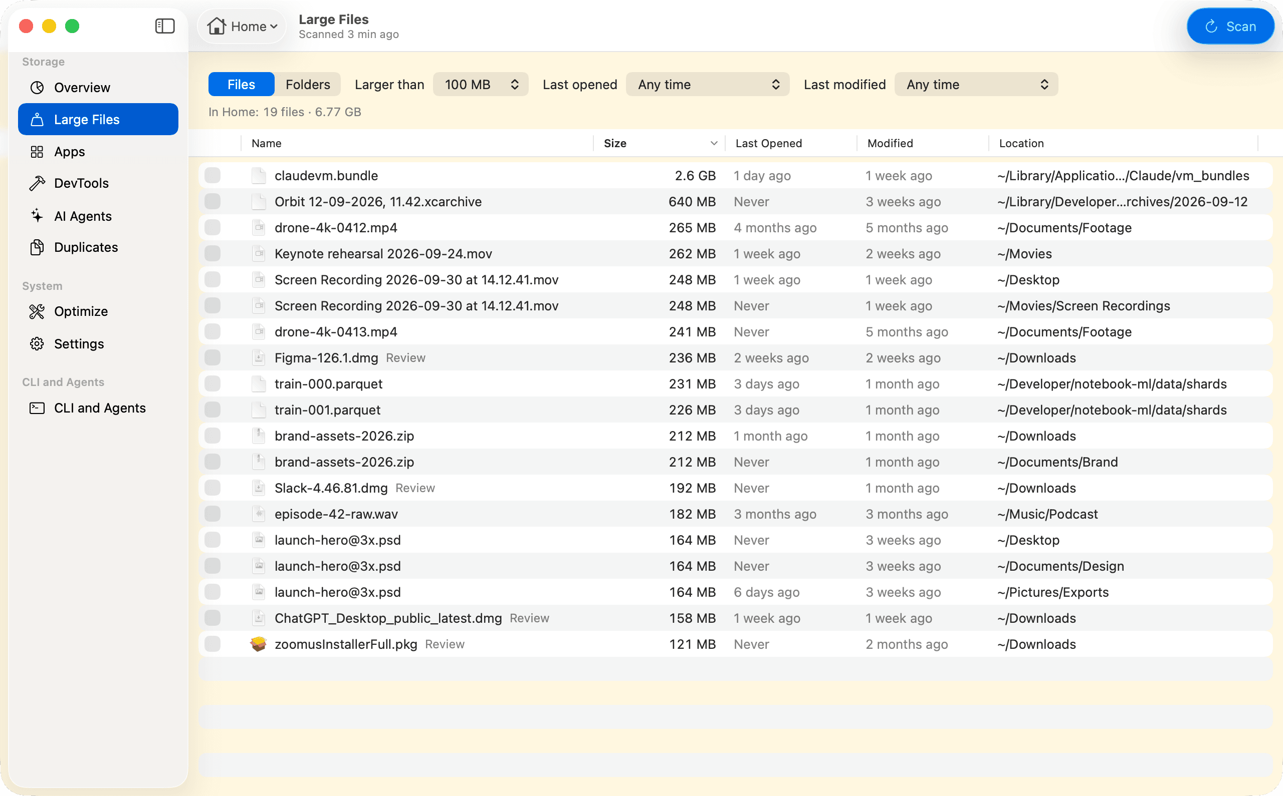 The Large Files view, filtered to files larger than 100 MB: 19 files in Home, 6.77 GB. Each row gives the file's size, when it was last opened and modified, and its location, from claudevm.bundle at 2.6 GB down. Installers such as Figma-126.1.dmg are marked Review.